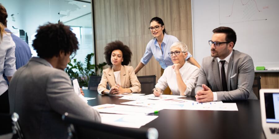 Tax professionals sitting around a conference room table.