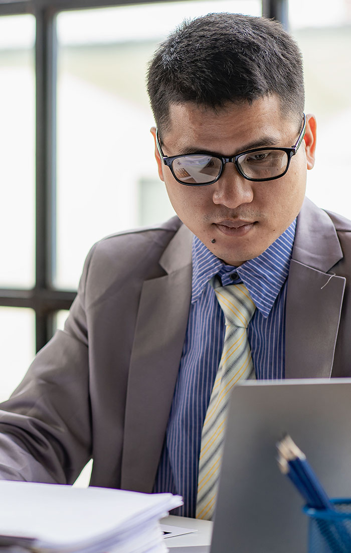 A tax consultant working in his office